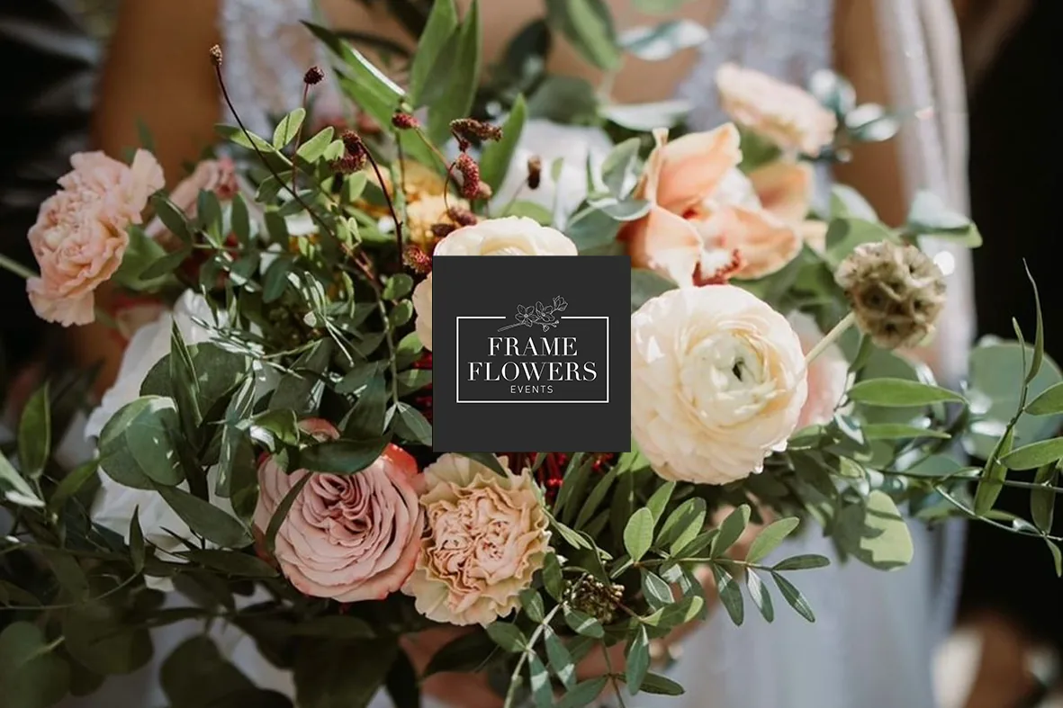 Bridal bouquet of roses and ranunculus in soft blush tones