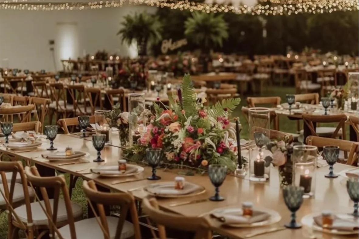 Long wedding tables with fairy lights at a celebration in Limassol